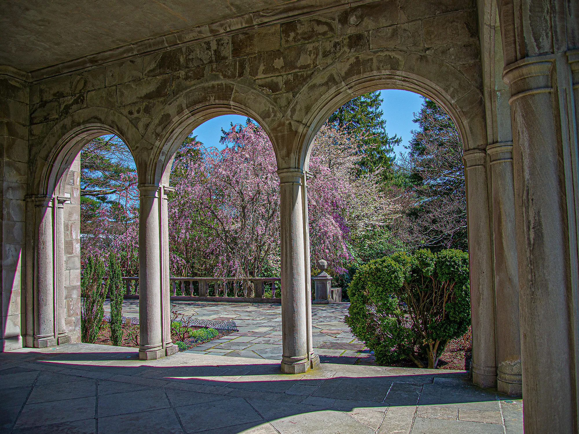 Arches of a building forming a frame within the frame around the scene beyond