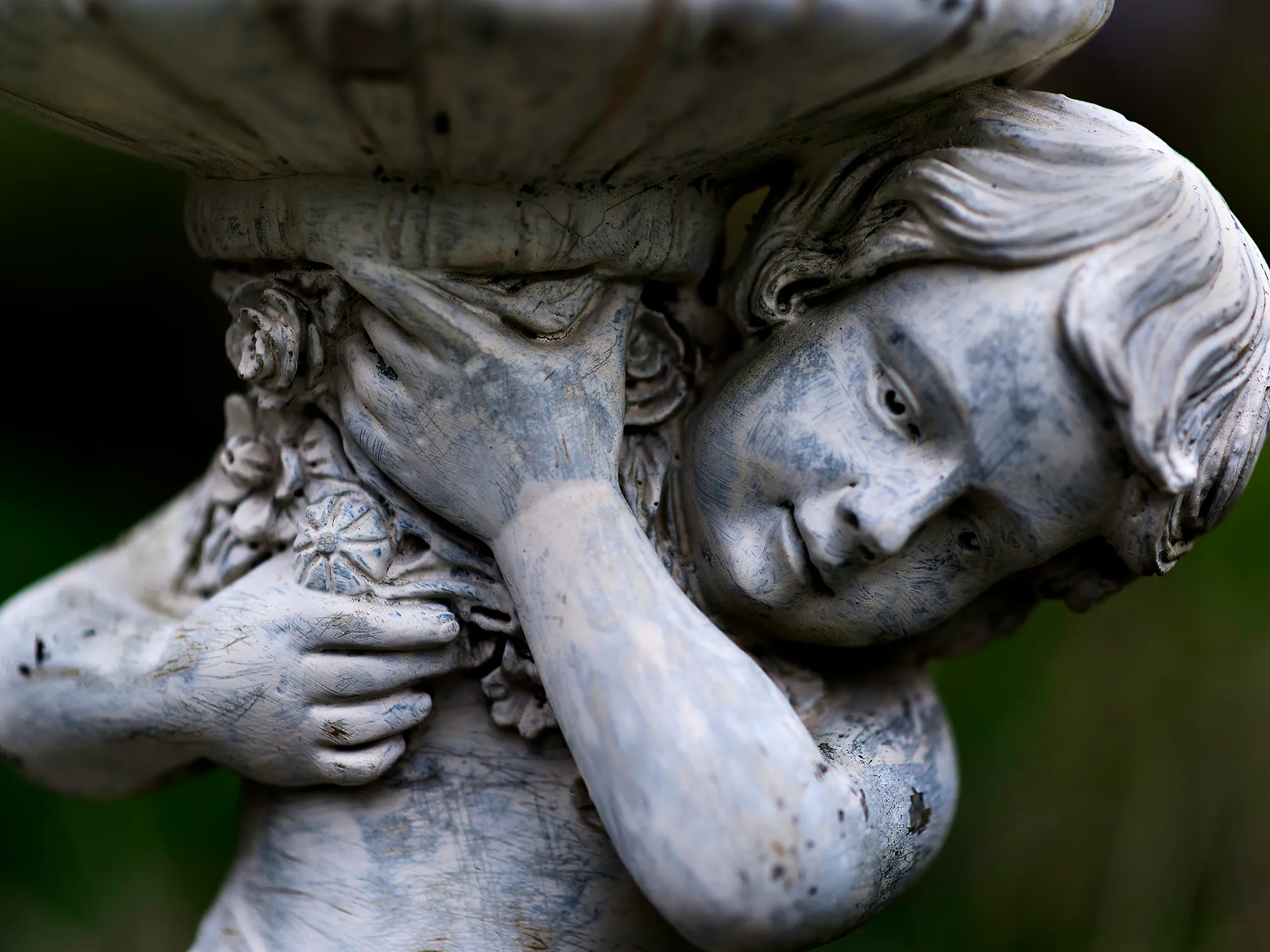 A close-up of a statue filling the frame with no space around it